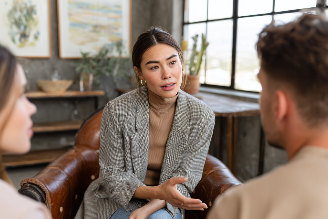 Couples therapist integrating schema therapy with EFT and Gottman Method techniques during a clinical training session.